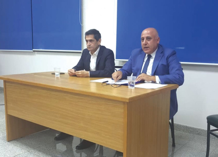 Joseph Deeb, adviser to the Minister of Energy and Water, speaking alongside Minister of Social Affairs Richard Kouyoumjian at Labora's eleventh annual delegates meeting, Deir Mar Antonios, Baabda, September 2019